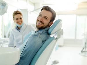 Man smiling while relaxing in treatment chair
