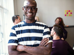 Man blue and white shirt smiling in office